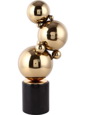 Steel ball sculpture plated in gold on marble