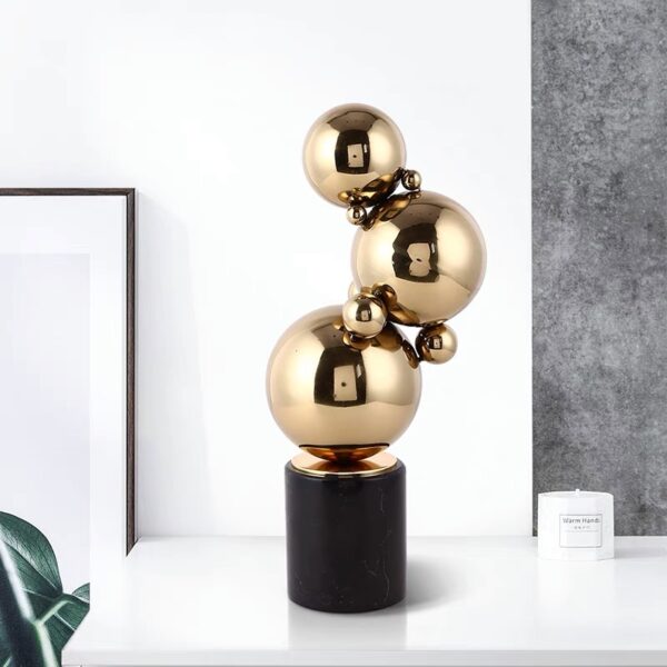 Steel ball sculpture plated in gold on marble - Image 3